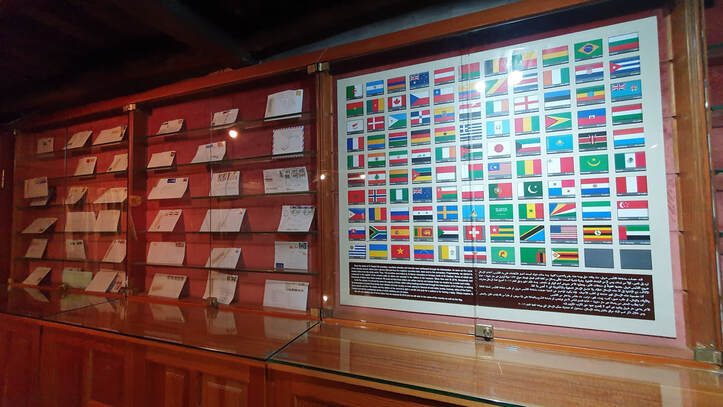 Letters of Miracles and the flags of its Countries of Origin on display at Saint Sharbel's Sanctuary in Annaya, Lebanon