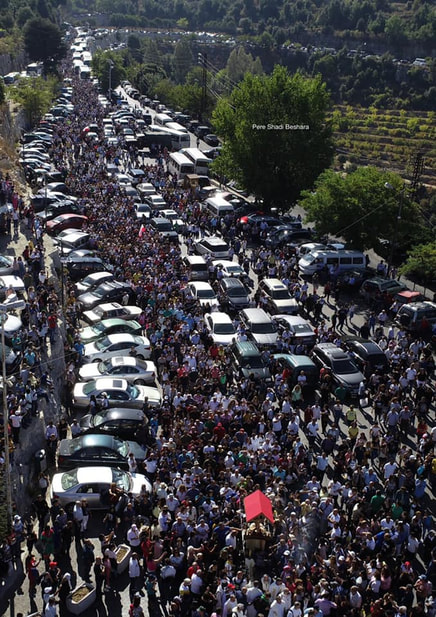 Thousands of people during a procession at the Sanctuary of Saint Sharbel in Annaya, Lebanon.